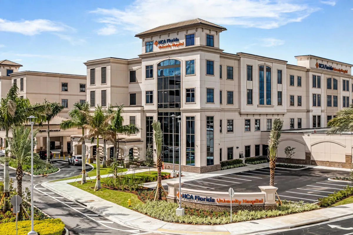 HCA Florida University Hospital in Davie, Florida — hospital exterior with palm trees and patient entrance