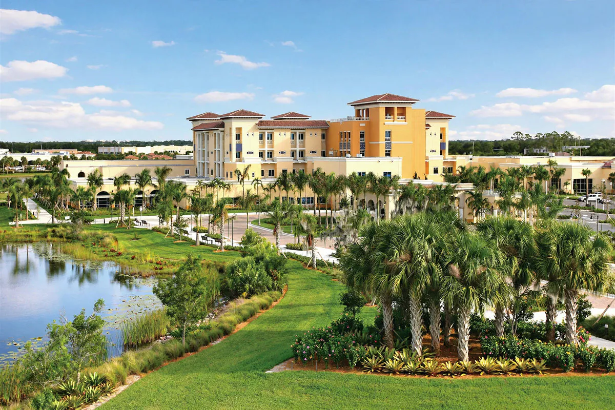 Suburban hospital exterior with palm trees and landscaped grounds in Miramar, Florida — Rafferty Domnick Cunningham & Yaffa